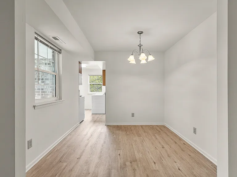 Dining Area with Luxury Vinyl Plank Flooring (shown here in a 3-bedroom floor plan)