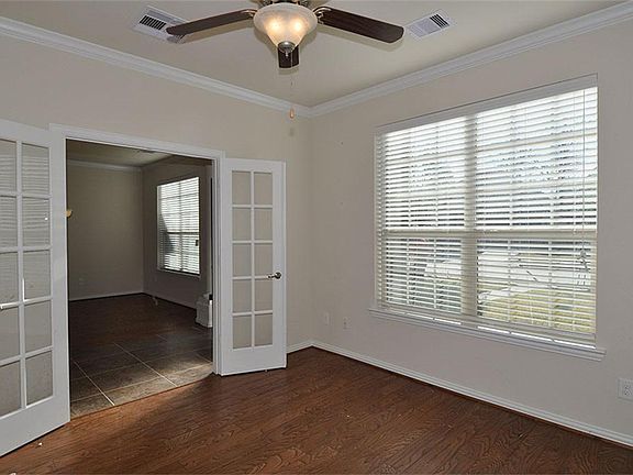 Study is to the left as you enter...engineered wood flooring, French doors.