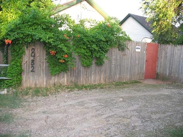 Parking off the alley for 2 cars. Red metal gate goes to the home's private patio and yard.