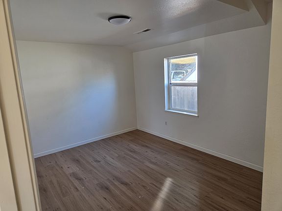 Front bedroom- new hardwood floors & paint.