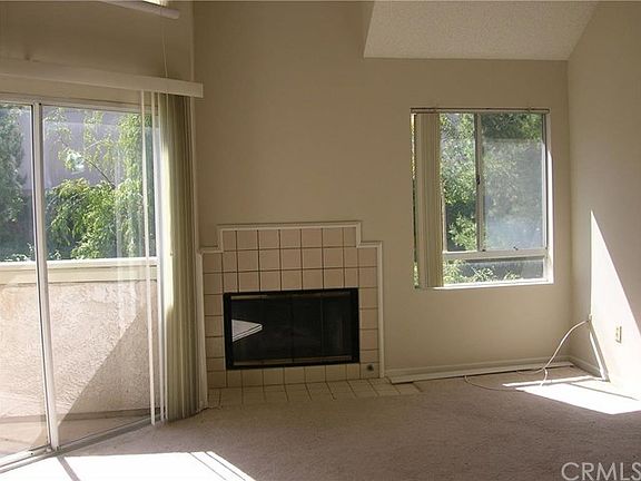 Living room with fireplace and slider to patio