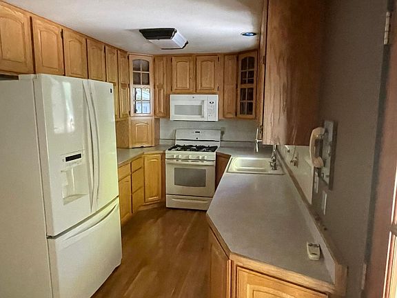 Kitchen has tons of cabinet space and gas range