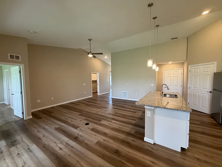 view from dining room of the kitchen and living room