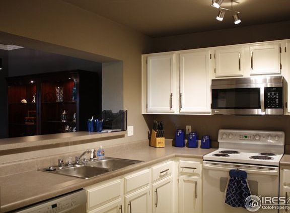 Freshly painted Kitchen with Contemporary lighting