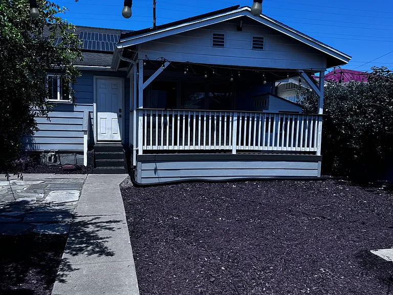 View of the back yard and covered patio.