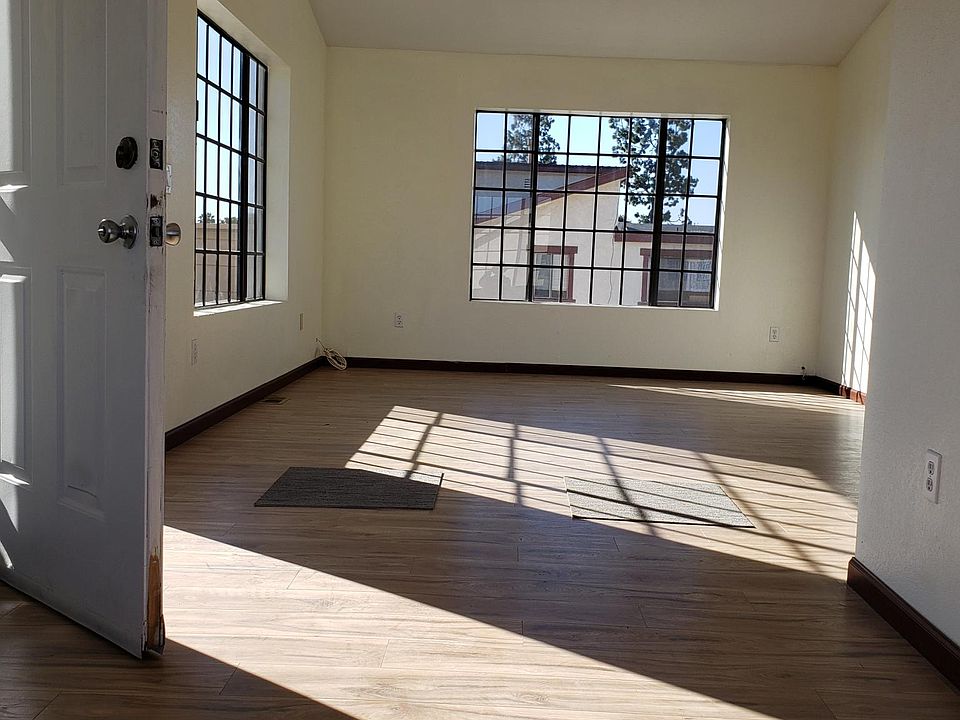 living room with new hardwood floor, high ceiling, very bright, airy and relaxing