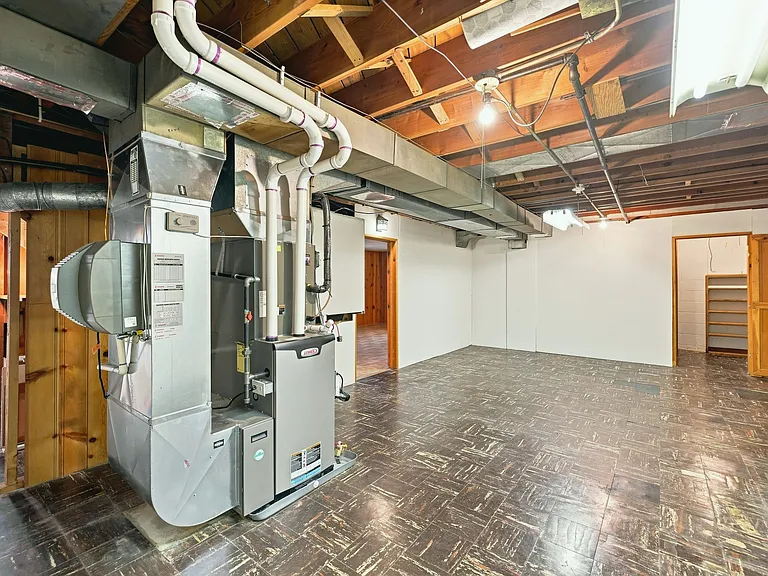Basement storage room. Tons of storage space down here. Clean and does not smell in any way. Furnace is brand new. Lots of light and tons of storage space!
