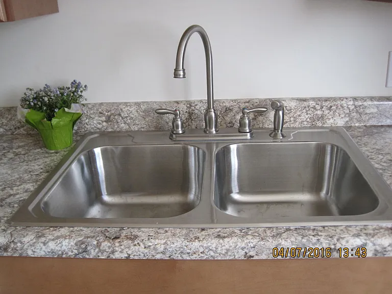 Double sink with lovely hardware.