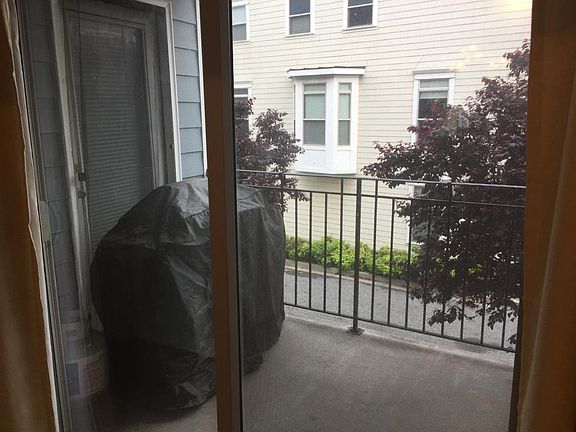 Balcony has sliding glass door and the grill stays!