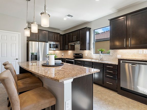 Kitchen with center island and stainless steel appliances
