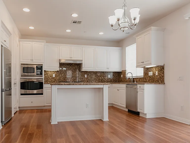 Kitchen with island and stainless steel appliances