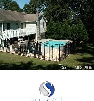 Concrete salt water pool in oh so private fenced backyard.