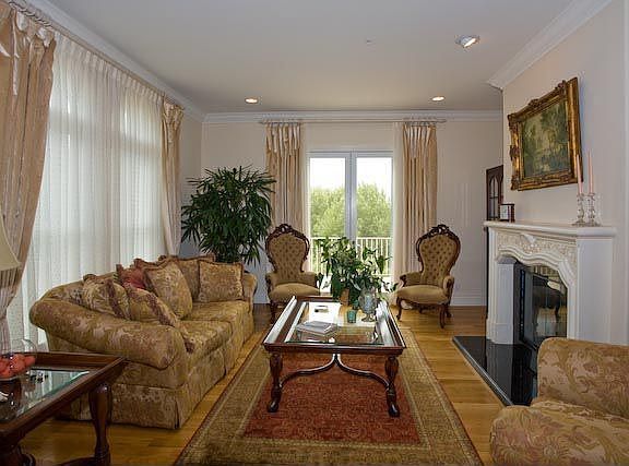 Formal living room with private balcony.