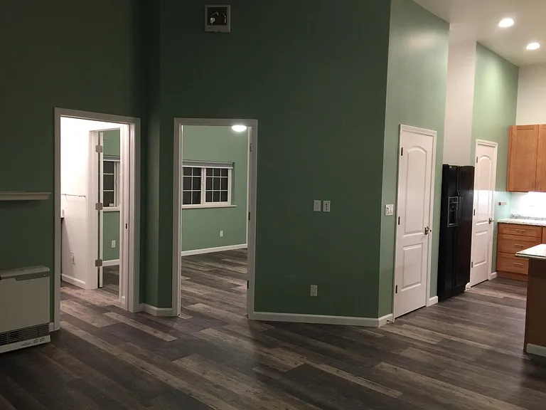 In the living room looking L-R bathroom, bedroom, kitchen