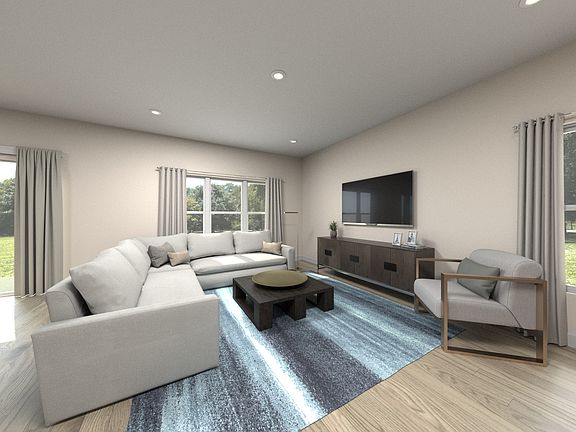 Residence 4 great room virtually staged at Traverse at Winding Creek.