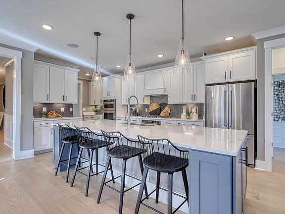 Open Kitchen with an oversized island perfect for additional seating opportunities and storage