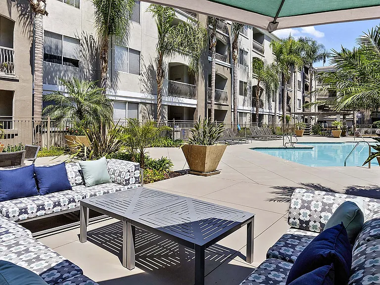 Stretch out on the comfy patio couch and savor the poolside views.