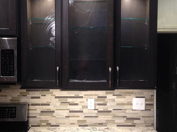 2 glass front cabinets with interior lights and glass shelves to display your special items.