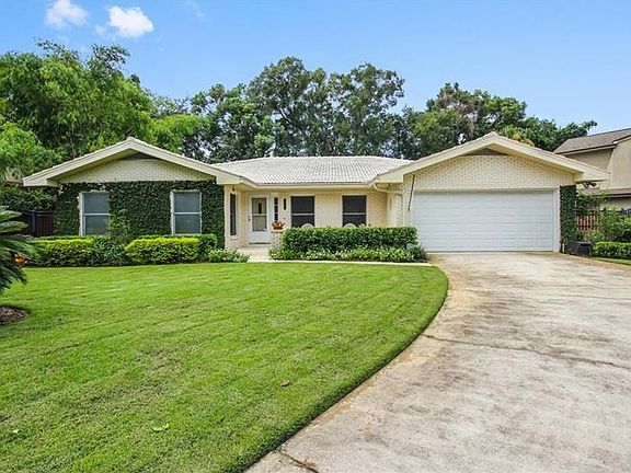 Front perspective with oversized driveway