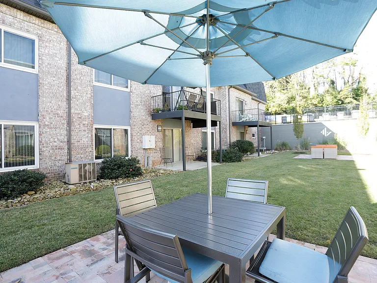 Relax and entertain in style on this inviting patio, perfect for sunny afternoons and cozy evenings.