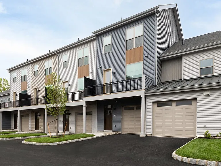 Signature Collection Townhomes with balconies and attached garages