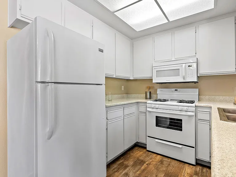 All-white kitchen at River Oaks in Oceanside, CA