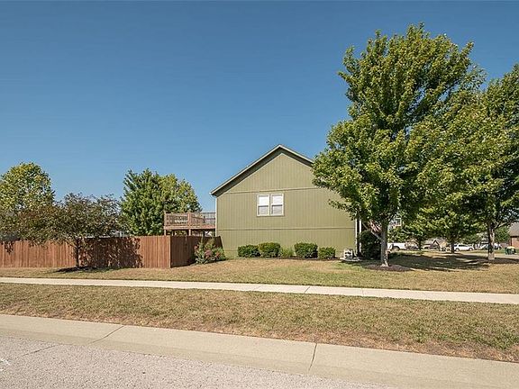 Coveted corner lot, no "in between the neighbors"!  Huge fenced in yard with deck and patio.  Lots of nice sized trees!