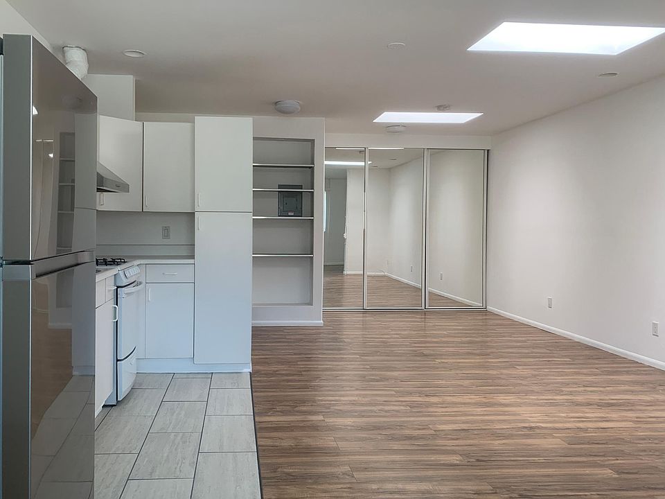 Loft w/ twin skylights and floor-to-ceiling closet.
