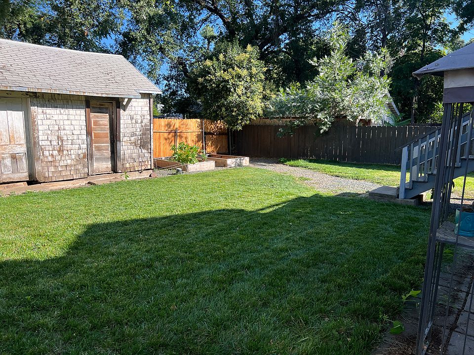 Backyard with two large garden boxes. Large shed for landlord use only.