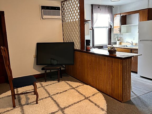 Living room looking towards open kitchen area