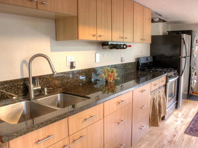 Kitchen, includes agas stove, oven, full size refridgerator, full size washer and dryer, ample cabinets