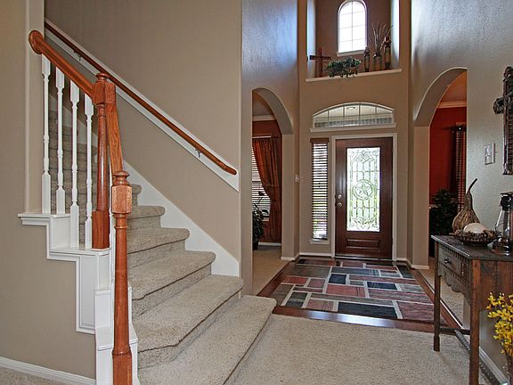 Another view of foyer & formals. Notice the decorator ledge and arched window 