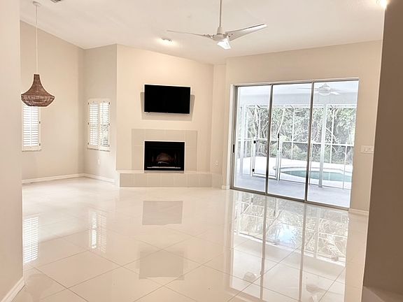 Living Room with Wood Burning Fire Place and Dining Area