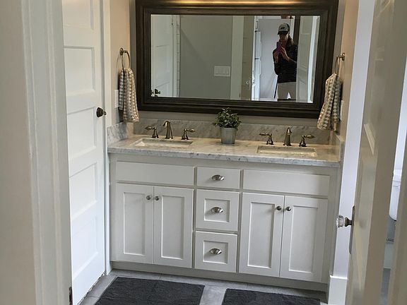 tiled bathroom with double vanity