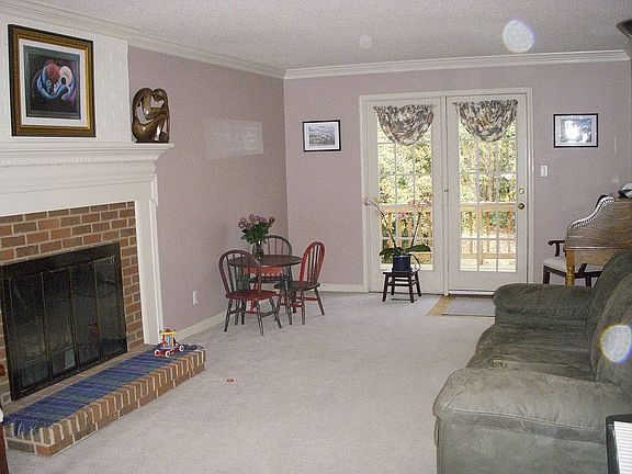 Light filled Living room with french doors to the deck