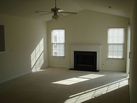 Large great room with gas fireplace and vaulted ceiling