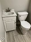 Bathroom vanity and toilet.