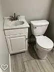 Bathroom vanity and toilet.