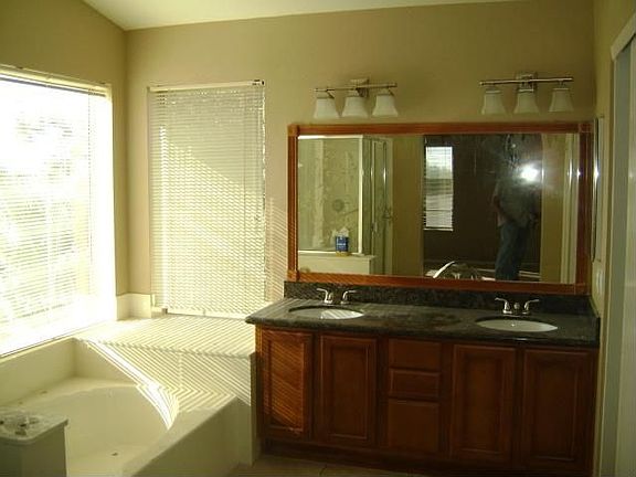 Master Bathroom with large walk-in and granite countertops