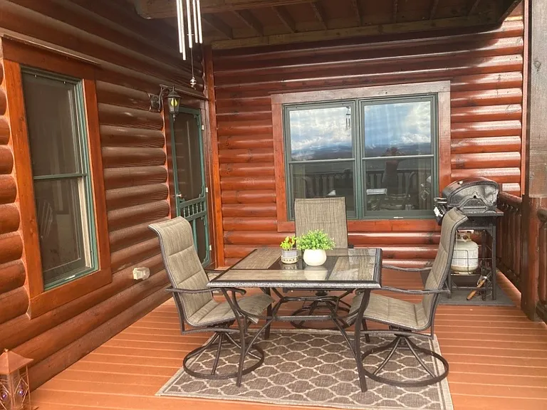 Deck with outdoor dining area.