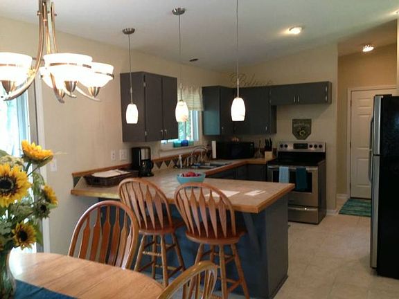 The heart of the home!! Freshly painted cabinets, recessed lighting, new appliances with stainless.