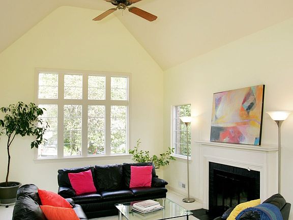 Living Room features cathedral ceiling and fireplace