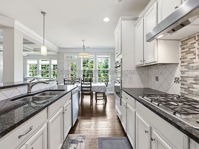 9659 Camberley Ave NW — Photo 16