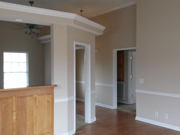 Pictured from rear of living room looking at edge of kitchen