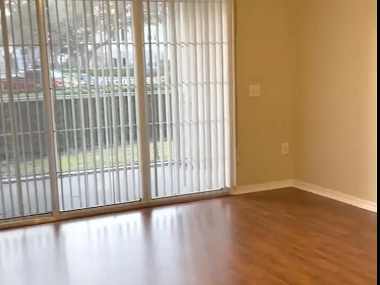Spacious living room filled with natural light.