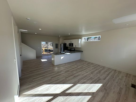Open living space and kitchen located on the first floor.
