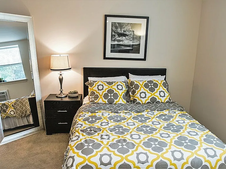 Experience comfort and style in this beautifully designed bedroom, perfect for relaxation.