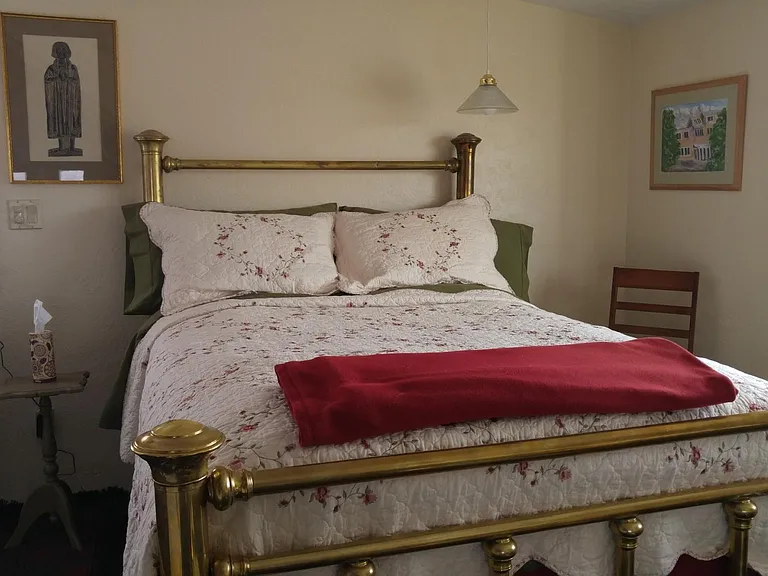 In the Loft you have our double sized Amish brass bed next to the bay window