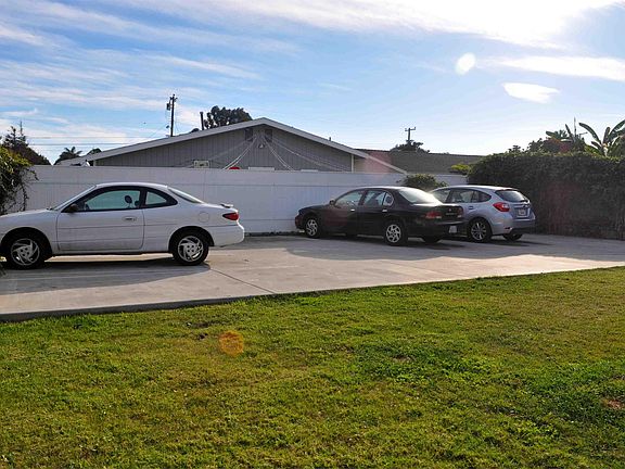 3 parking spaces per unit in back of property and rear yard