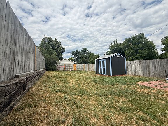 Back yard with shed from the side of the house